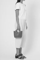 Black Behno New York Katrina Mini Tote No2 shoulder bag with python and nappa leather accents, on body view.