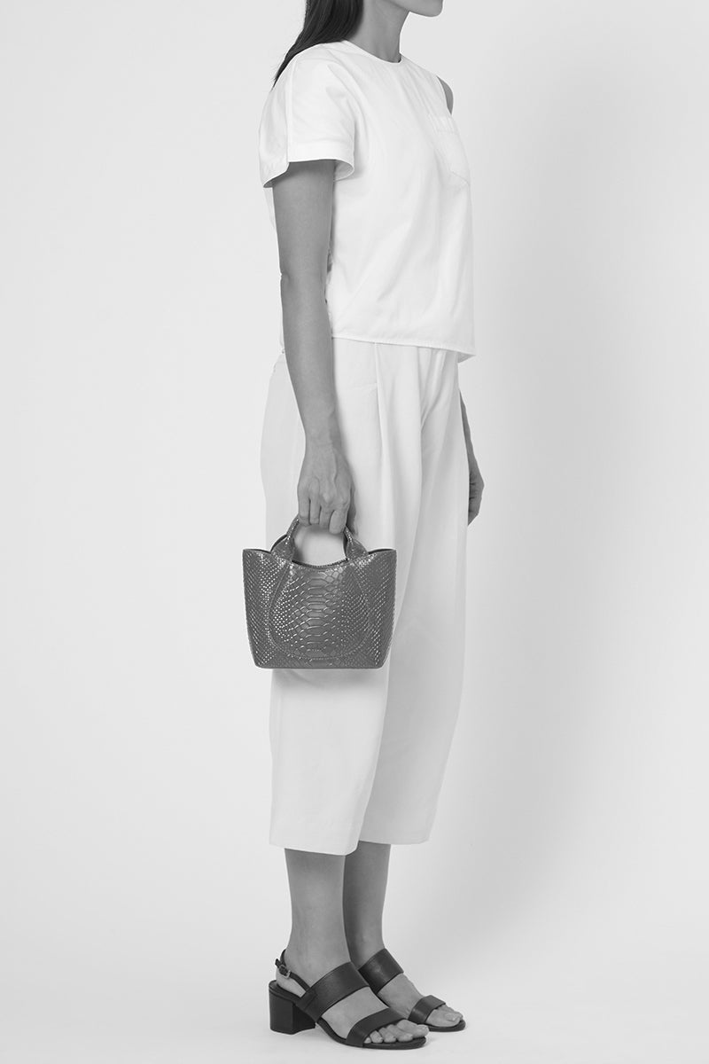 Black Behno New York Katrina Mini Tote No2 shoulder bag with python and nappa leather accents, on body view.