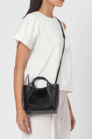 Black crinkle leather Katrina Mini Tote No2 shoulder bag by behno New York, shown on body for stylish everyday carrying.