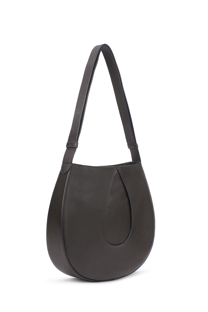 Behn New York Nilde Hobo shoulder bag in rich cacao milled leather, showcasing its stylish 3/4 view and textured finish.