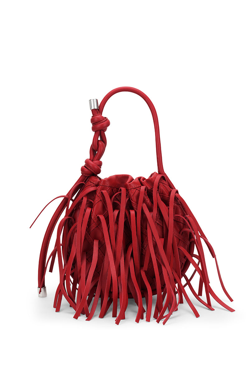 Red INA mini potli fringe nappa top handle bag by behno New York, featuring a sleek design with fringe details in the front.