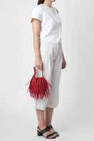 Red INA Mini Potli Fringe Nappa top handle bag by behno New York, featuring fringe details and a compact, stylish design.