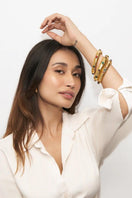 Gold Giza stone bangle bracelet by Ben Amun featuring a smooth, rounded gold finish and natural Giza stone accents.