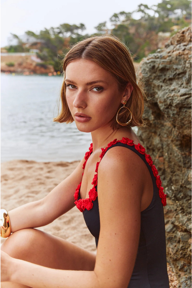 Señorita Satuna swimsuit in black, stylish one-piece with sleek design, perfect for swimming or beachwear.