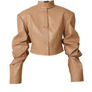 Beige faux leather cropped blazer by Blikvanger, featuring a tailored fit and stylish design, shown on a white background.