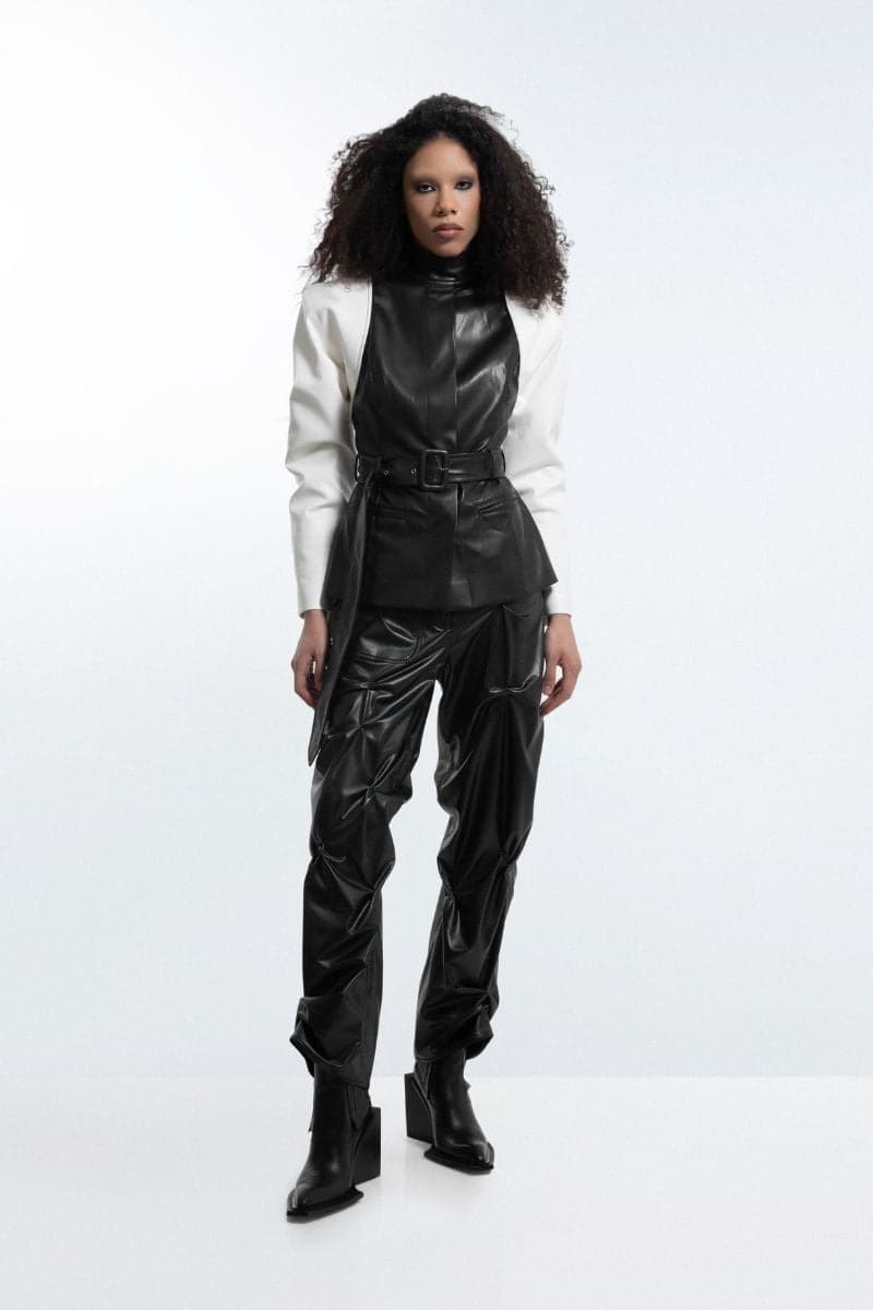 Black and white blazer jacket by Blikvanger, tailored fit, with lapel collar and button closure, shown in XS size.