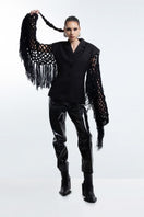 Black fishnet-sleeve blazer by Blikvanger, featuring a tailored fit and stylish fishnet detail on the sleeves.