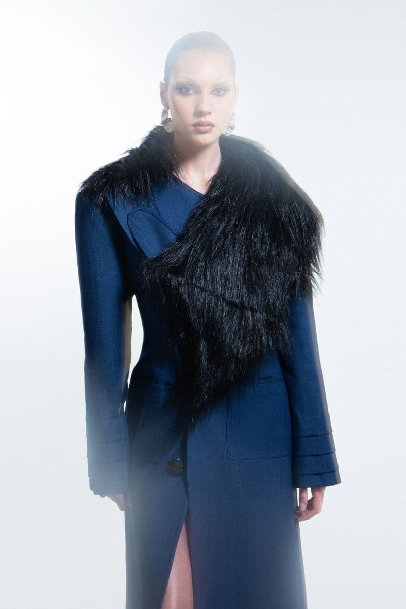 Blue denim furry long coat by Blikvanger, shown in blue with plush fur details and a tailored fit.