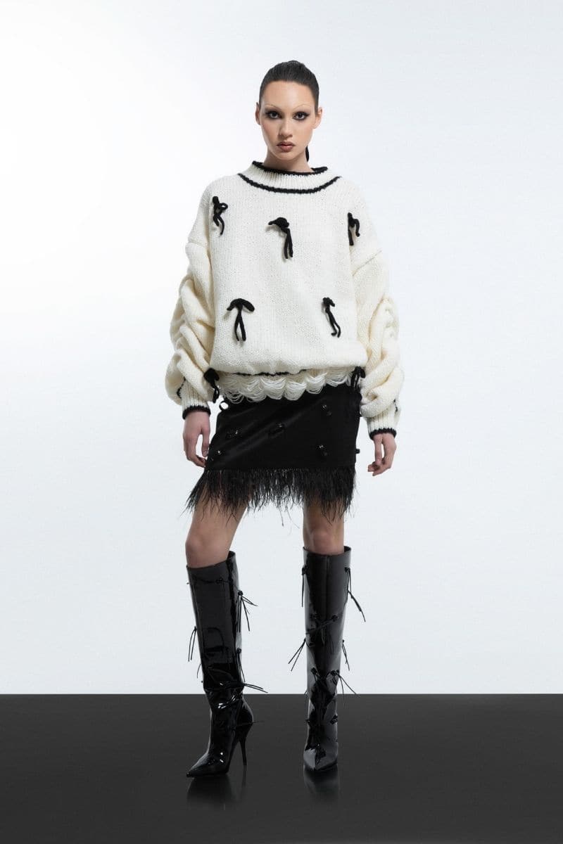White Blikvanger cream cake knitted sweater with a cozy, textured knit pattern, shown on a mannequin in XXS size.