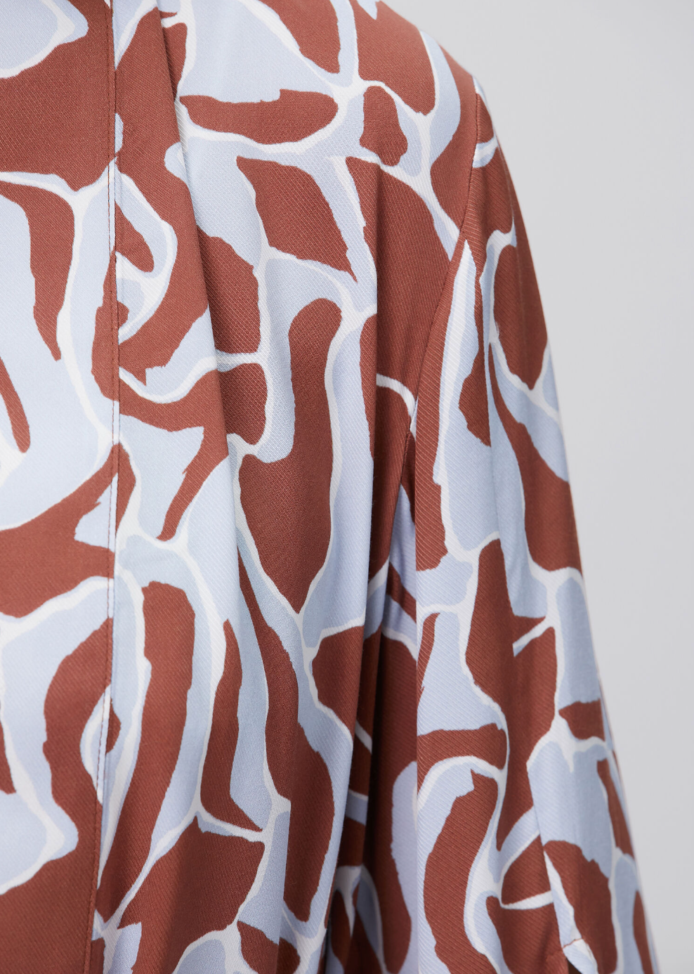 Maliluha Bonheur Kimono cover-up with floral patterns, lightweight fabric, and relaxed fit displayed in the image.