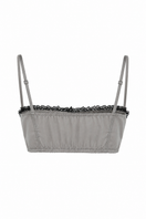 TAGG lace trim bralette with elastic back, featuring delicate lace details and comfortable fit, designed as a stylish top alternative.