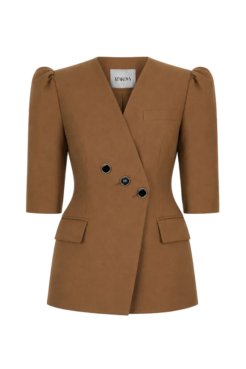 Izakova brown blazer with tailored fit and classic lapel, displayed on a hanger against a neutral background.