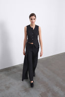Black Calin asymmetric tie vest by SÉLONE, featuring a stylish wrap-over design and tailored fit.
