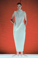 DELEGAN cocoon midi skirt in milk color, featuring a stylish design, displayed in a fashion campaign image.
