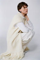 Textured knit vest from DELEGAN, a stylish cardigan with a cozy, patterned knit design, perfect for layered fall outfits.