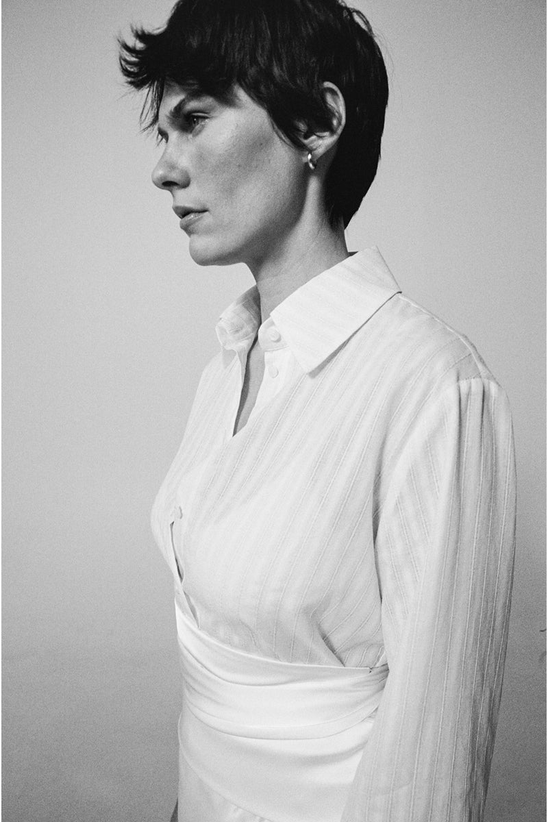 DELEGAN milk textured shirt displayed on a model, showcasing the fabric's unique texture and stylish fit.