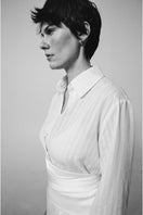 DELEGAN milk textured shirt displayed on a model, showcasing the fabric's unique texture and stylish fit.