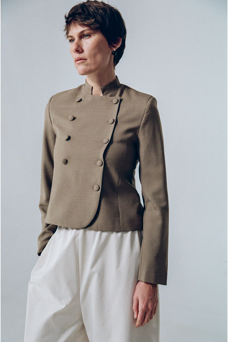 Delegen crop wool blazer, tailored fit, in neutral color, featuring lapel collar and button front, stylish and professional.