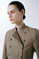 Delegan crop wool blazer on model, tailored fit with lapel collar and button closure, perfect for smart-casual styling.