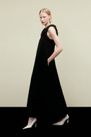 Elegant DELEGAN KOSSA maxi dress displayed in a campaign image, featuring flowing fabric and a stylish, full-length design.