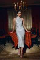 Aisl champagne halter maxi dress with matching scarf, flowing fabric, and elegant design suitable for formal occasions.