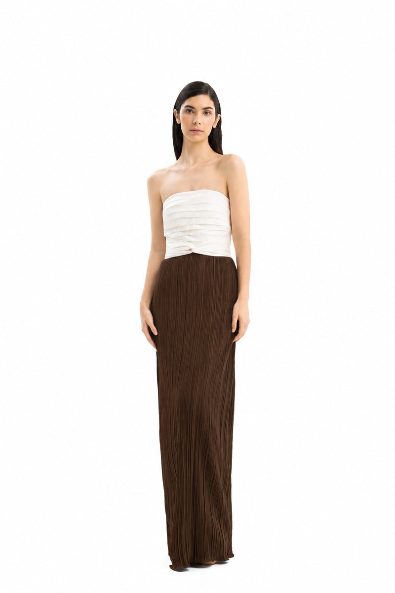 Maylé Vásquez CULT MIA X Malyé Vásquez canela brown and off-white maxi dress on a model, featuring a flowing design.