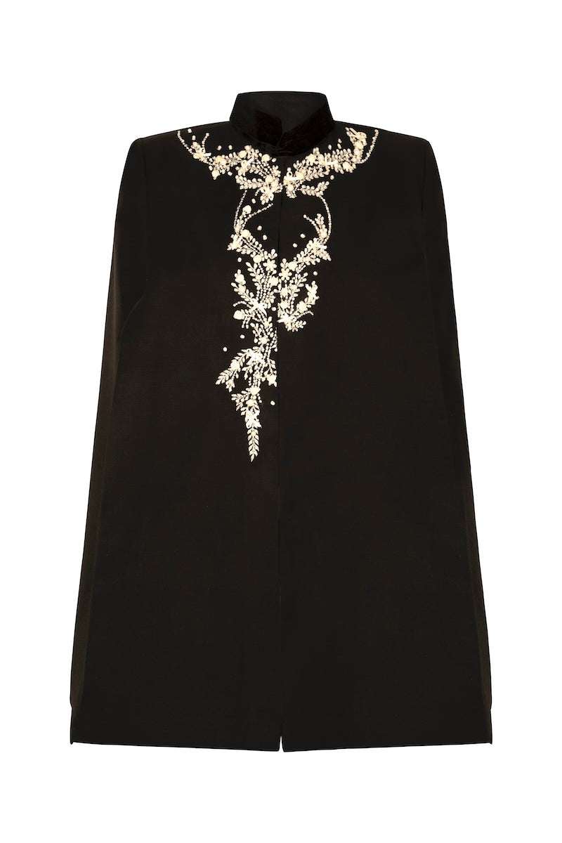 Nadya Shah Cape Nocturne jacket shown from the back, stylish black jacket with flowing fabric and elegant design.