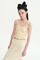 Beige Nora tank top from Chictopia, sleeveless top with a relaxed fit, shown on a neutral background.