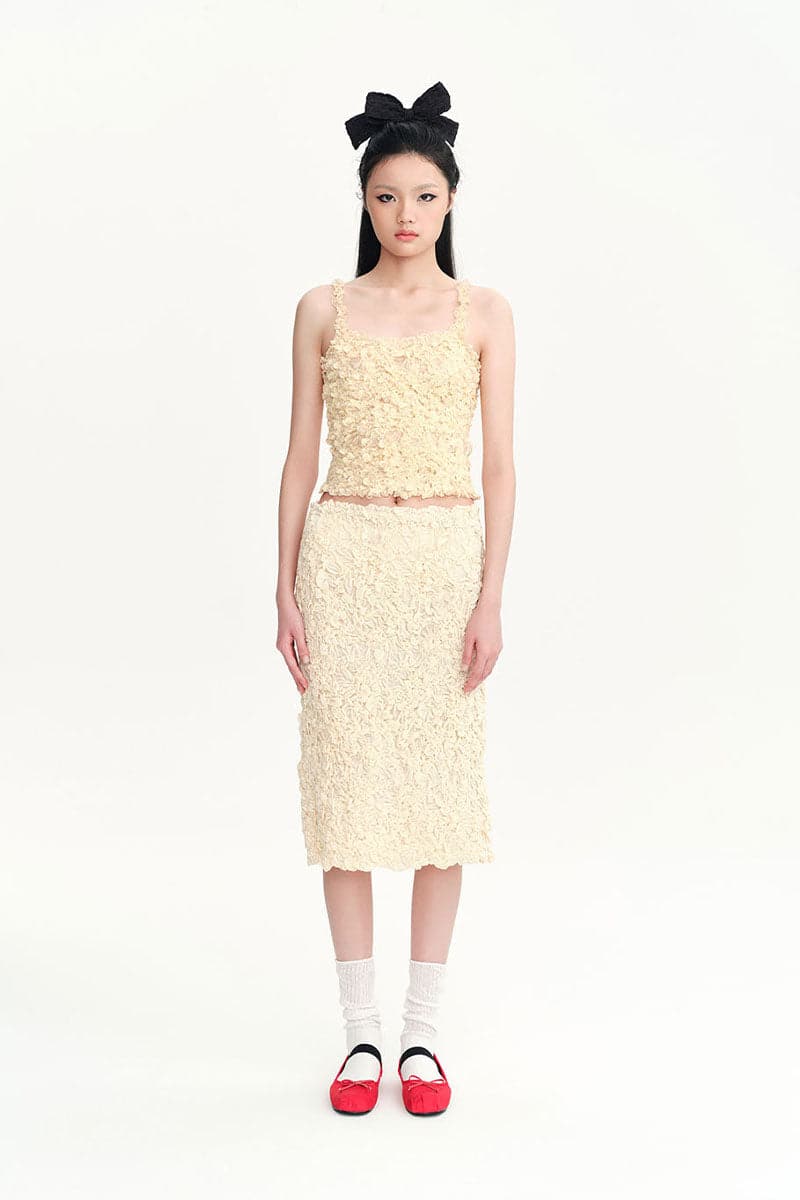 Beige Nora tank top by Chictopia, sleeveless casual top with a fitted design, shown on a neutral background.