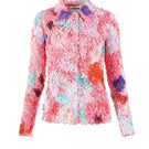 Pink floral smocked shirt by Chictopia with ruffled sleeves and a fitted bodice, displayed on a neutral background.