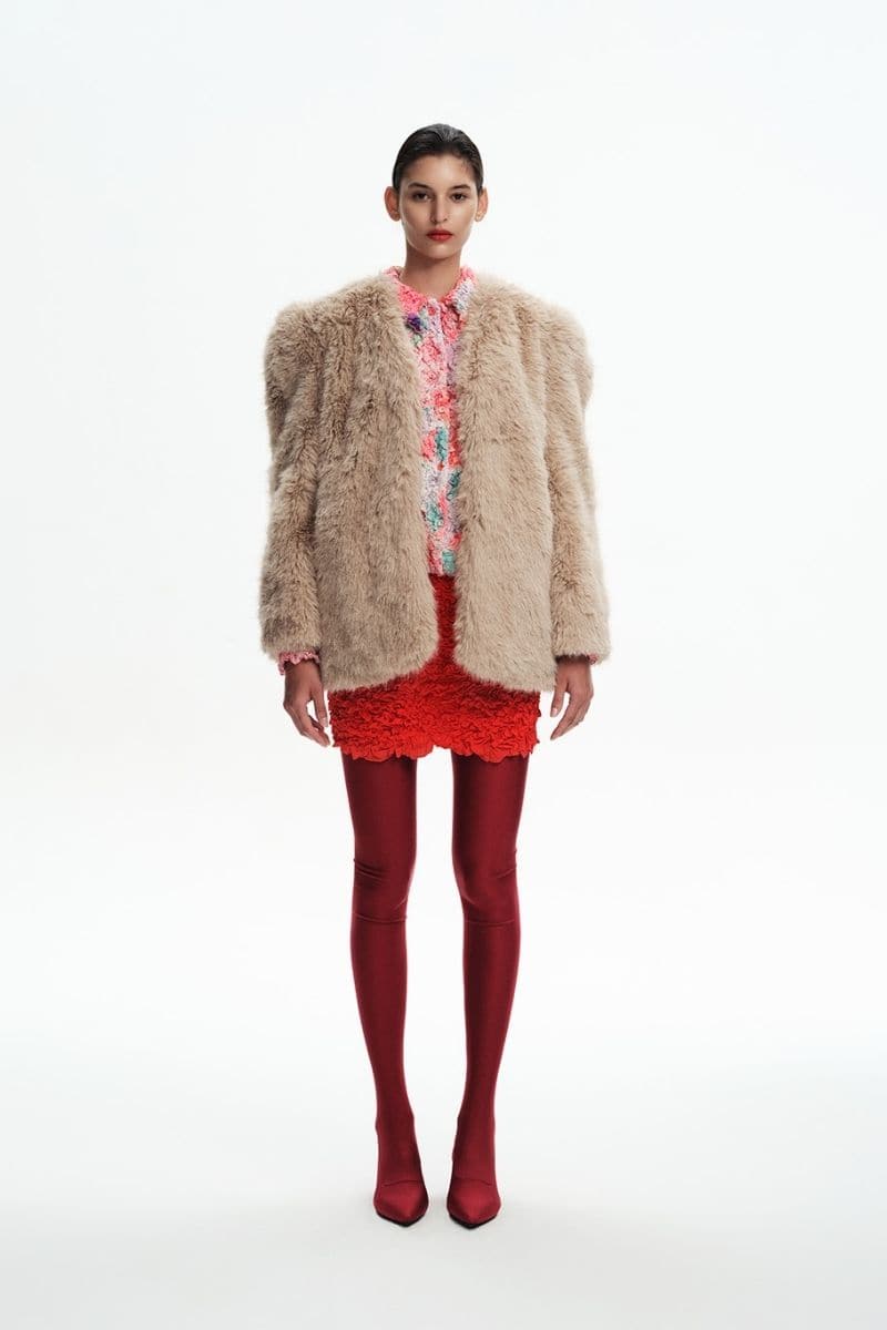 Chictopia tan faux fur jacket, stylish outerwear with plush texture, shown on a hanger against a neutral background.