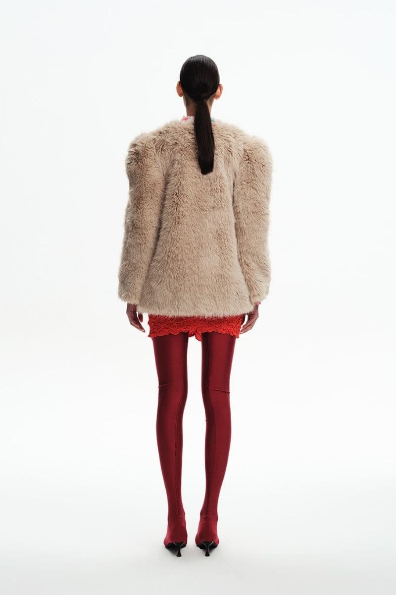 Tan faux fur jacket by Chictopia, stylish lightweight jacket with plush fur texture, shown on a model.