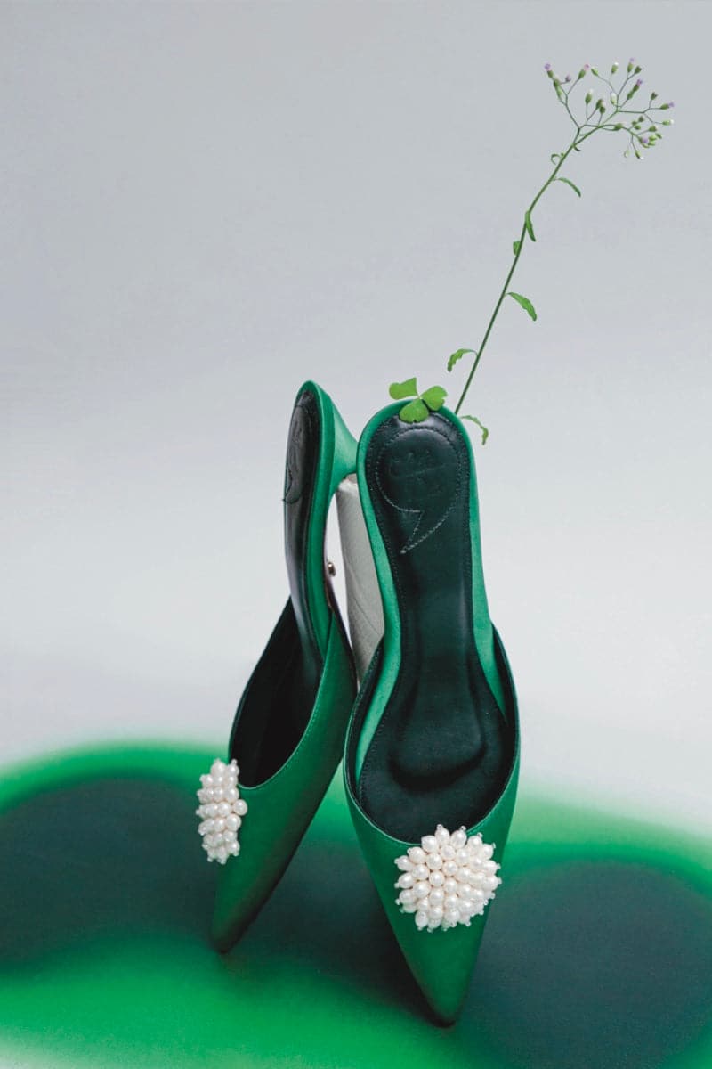 Forest green kitten heels by Christin Wu, featuring a sleek design, pointed toe, and elegant heel height.