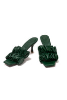 Christin Wu Poppy Tourmaline Green Mules with block heels, featuring vibrant green suede and a stylish slip-on design.
