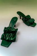Christin Wu Poppy Tourmaline Green Mules heels with pointed toe and sleek design, size EU 36, on a white background.