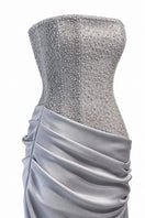 Urban Muse Clarisse gown in grey, elegant full-length dress with a flowing design and subtle fabric texture.