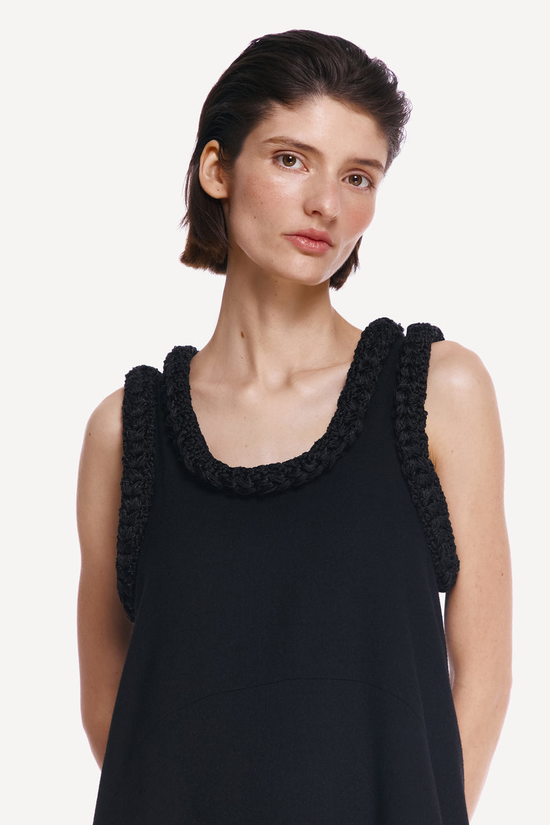 Close-up of the DELEGAN KOSSA MAXI DRESS showing its elegant fabric and detailed stitching.