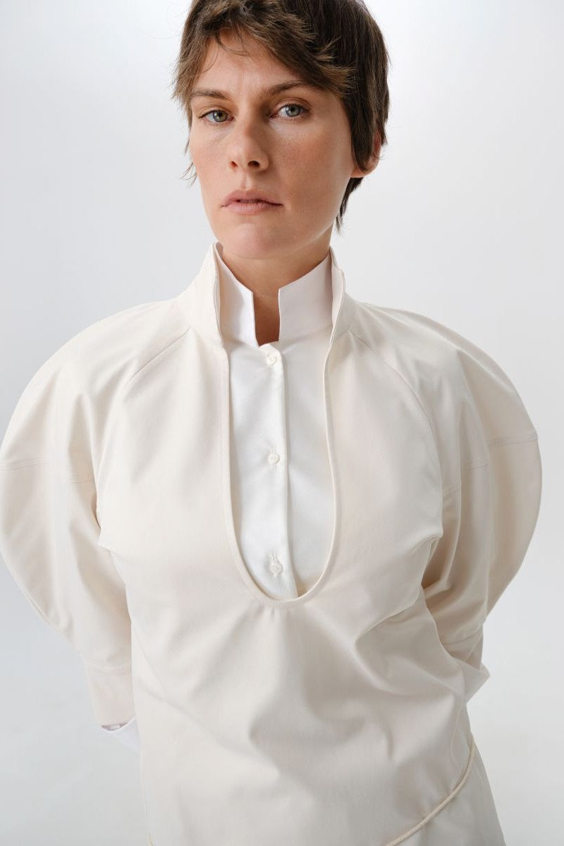 Close-up of DELEGAN gray-beige structure shirt showing textured fabric and detailed stitching.