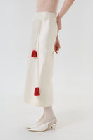Close-up of DELEGAN velvet blush silk midi skirt showing soft fabric texture and elegant drape.
