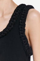 Close-up of the DELEGAN KOSSA MAXI DRESS showing intricate fabric details and elegant design.