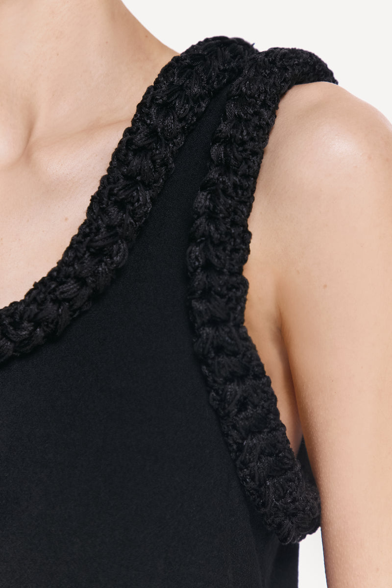 Close-up of the DELEGAN KOSSA MAXI DRESS showing intricate fabric details and elegant design.