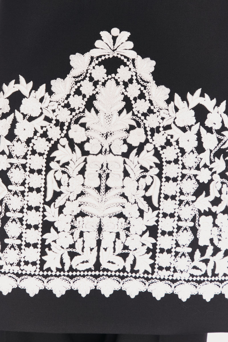 Close-up of the DELEGAN Plakhta Filigree Midi Skirt showing intricate filigree detailing and lightweight fabric.