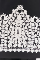 Close-up of DELEGAN Plakhta Filigree Midi Skirt showing intricate lace details and lightweight fabric.