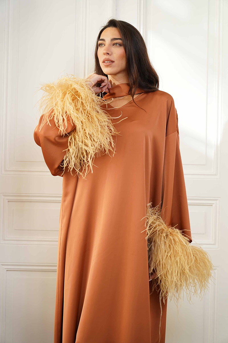 Close-up of Joanna Andraos Cult Mia X Joanna Andraos Amber Silk-Effect Gown showcasing its elegant fabric and detailed design.