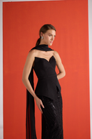 Close-up of Joanna Andraos black embroidered corset co-ord set showing detailed embroidery and fitted bust design.