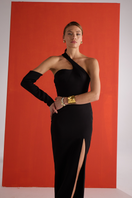 Close-up of Joanna Andraos black gown with detachable sleeves, showcasing elegant fabric and detailed design.