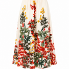Back view of Raishma crystal midi skirt with detailed crystal embellishments and flowing fabric for elegant style.