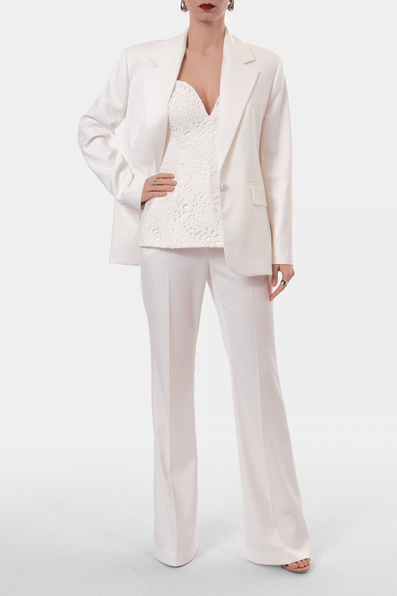 Off-white embroidered Lamia corset top from AGGI by HALEWSKI, featuring intricate embroidery and fitted design.
