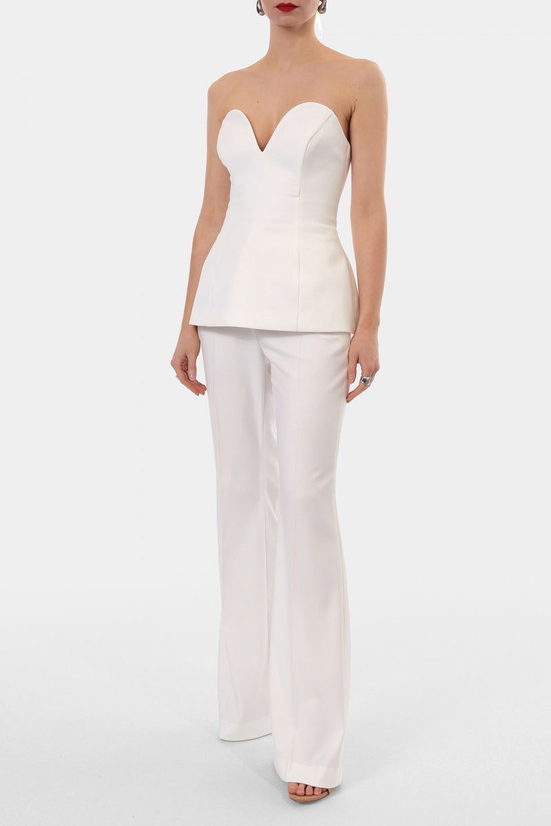 Off-white Lamia corset top by AGGI by Halewski featuring structured design and adjustable straps, shown on a hanger.