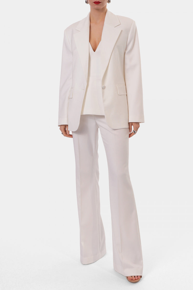 Off-white LAMIA corset top by AGGI by HALEWSKI featuring structured design and adjustable straps, displayed on a mannequin.